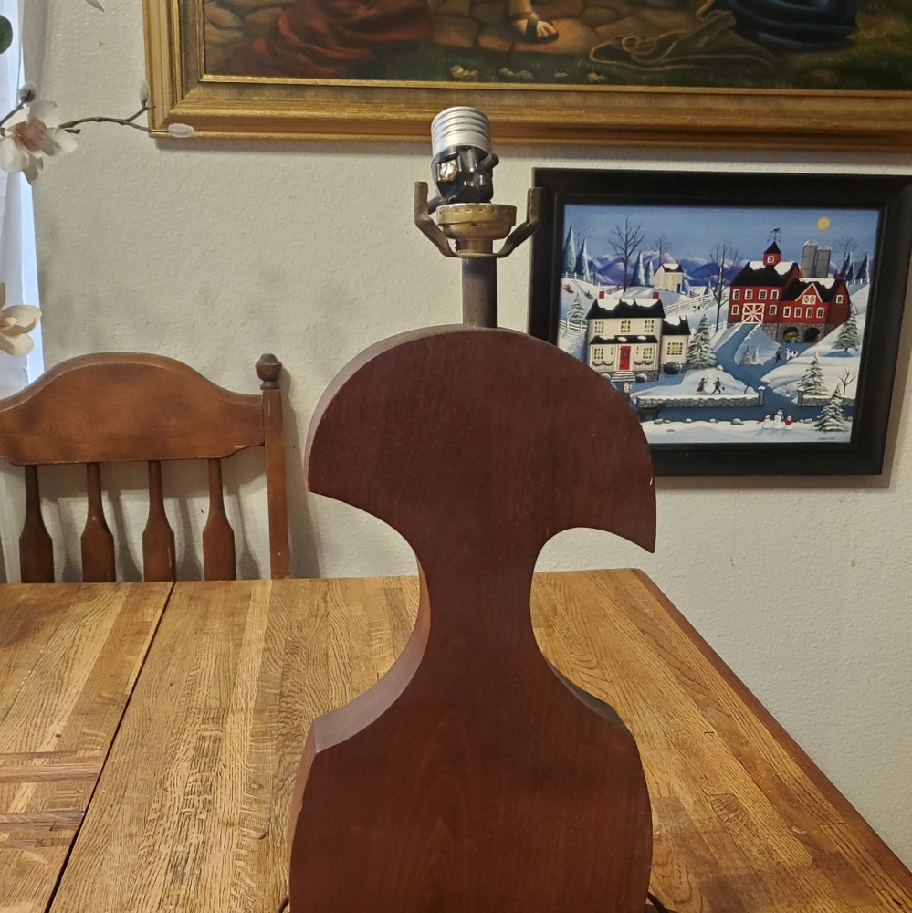Heavy solid hand carved vintage wooden lamp.